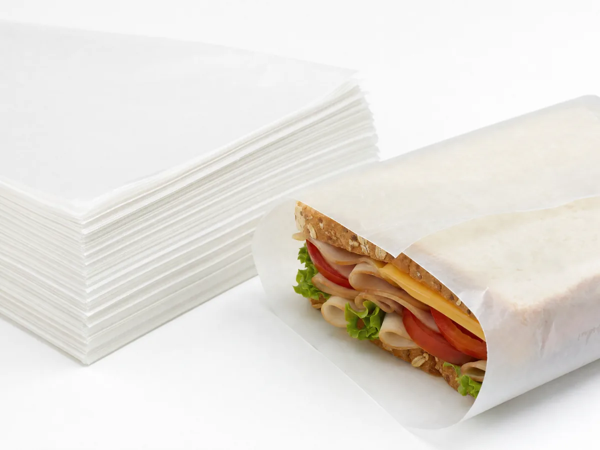 Dry wax deli paper sheets stack with sandwich wrap — grease-resistant semi-translucent deli paper wholesale