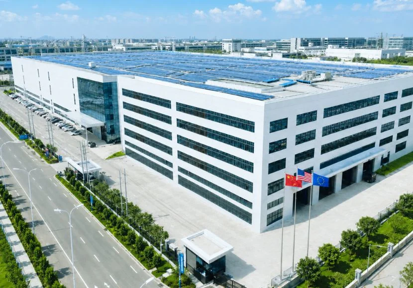 High-speed production lines running CupsPak orders — modern production complex with solar-powered roof and international export capabilities