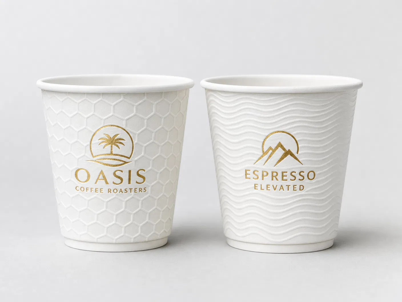Custom embossed paper cups with honeycomb and wave patterns, gold foil logo printing — CupsPak premium finishing